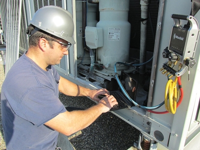 HVAC technician doing a maintenance