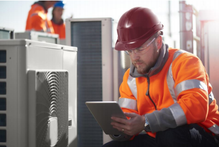 technician checking the HVAC unit